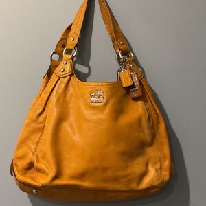 Coach Women's large mustard color bag.
